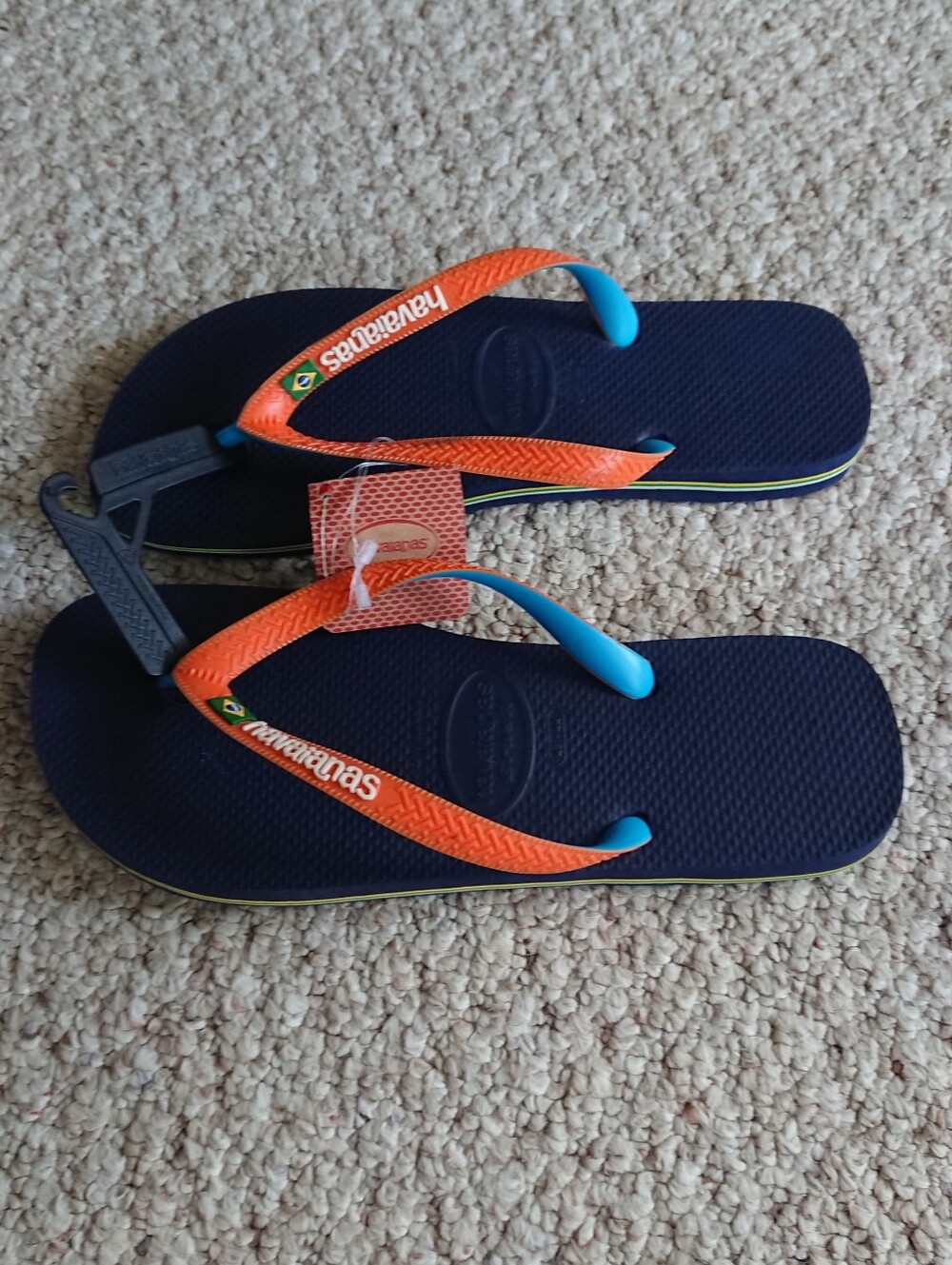 Havaianas Brasil Mix Flip Flops in a navy blue and orange colorway size 10/11
